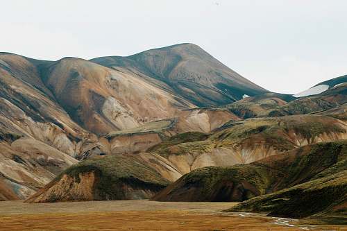 desktop wallpapers green and brown mountain under white sky photo during daytime desktop backgrounds